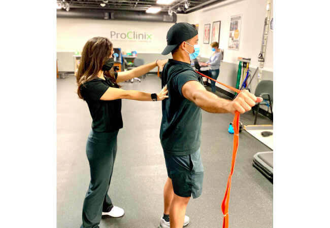 A physical therapist attending patient