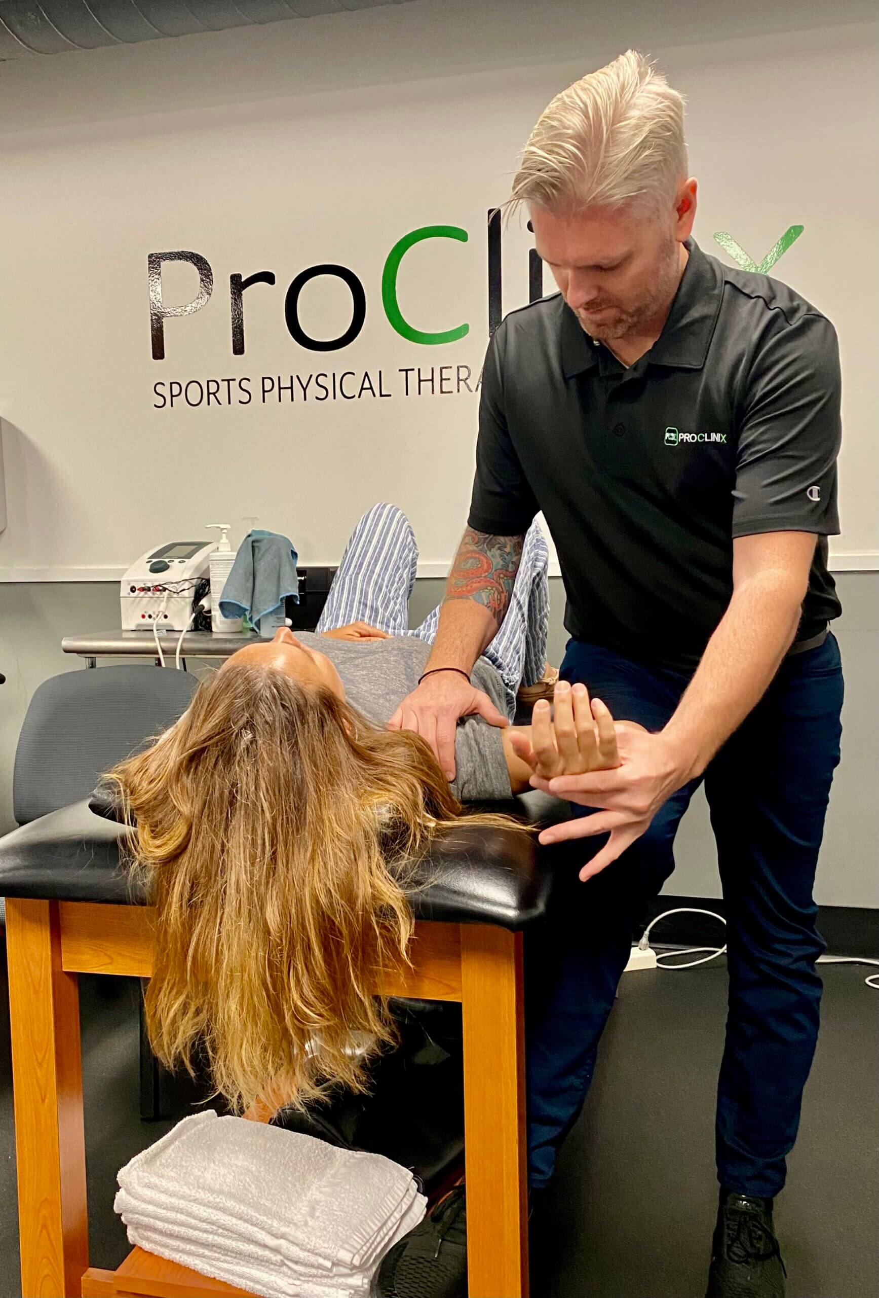 ProClinix-Sports-Physical-Therapy-Chiropractic-Dan-Bogart-PT-MS-providing-joint-mobilization-to-improve-shoulder-pain-and-mobility-scaled.jpg