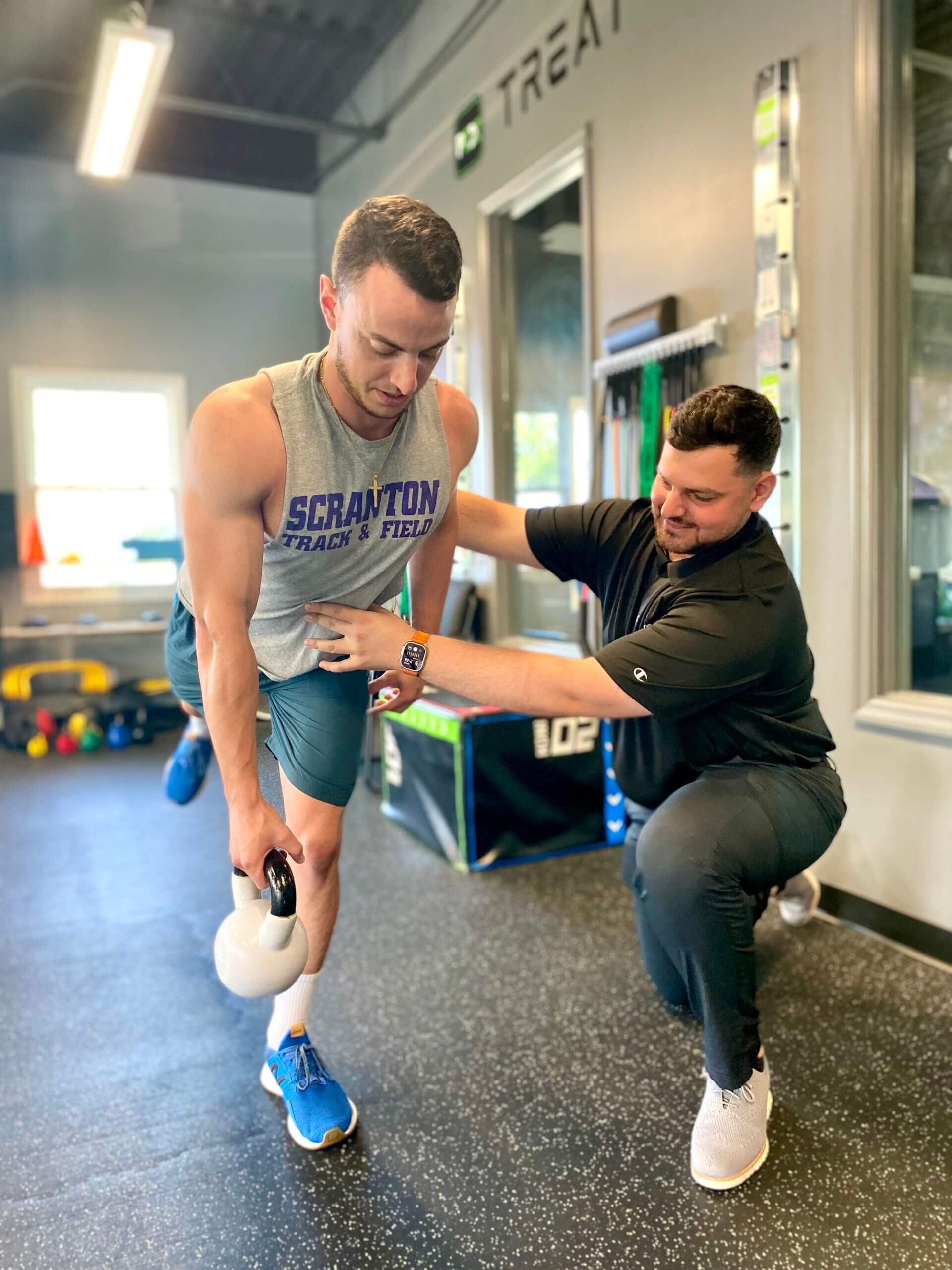 ProClinix Sports Physical Therapy & Chiropractic - Dr John Shlimoun, PT, DPT ensuring this patient has adequate form when performing single leg deadlifts